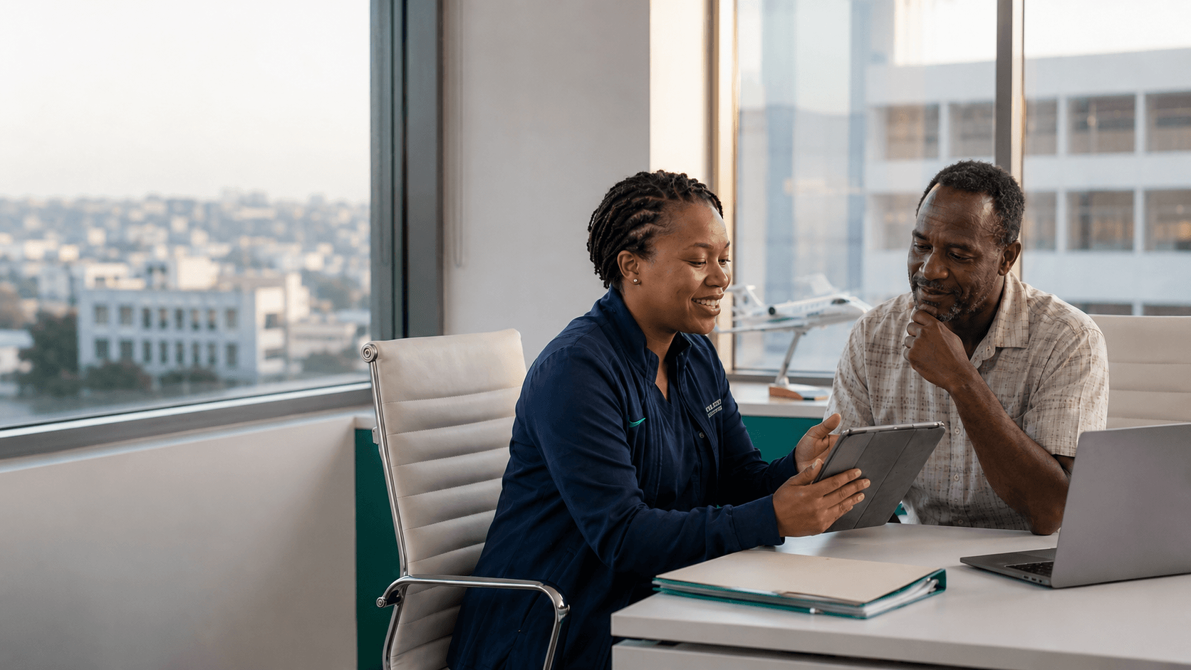 A doctor reviewing a patient's medical case on a tablet during a consultation